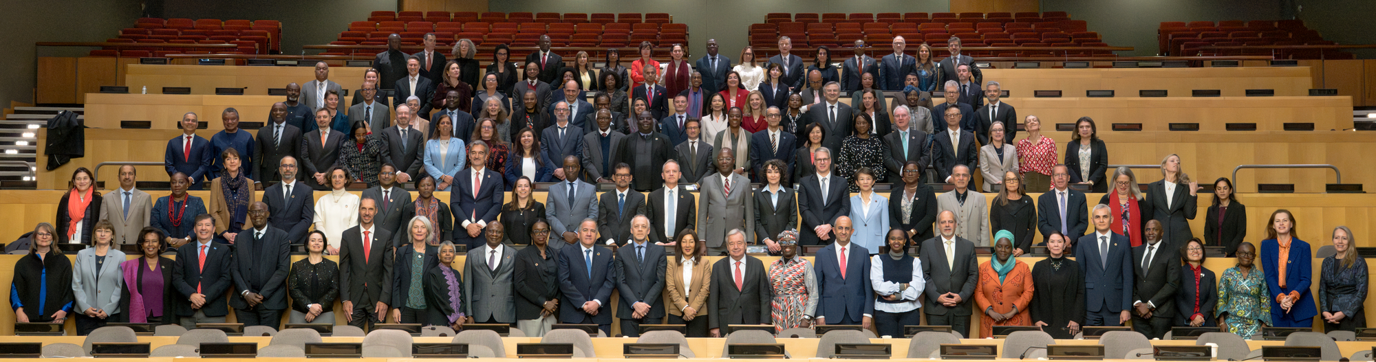 A group of people in a very large room 
