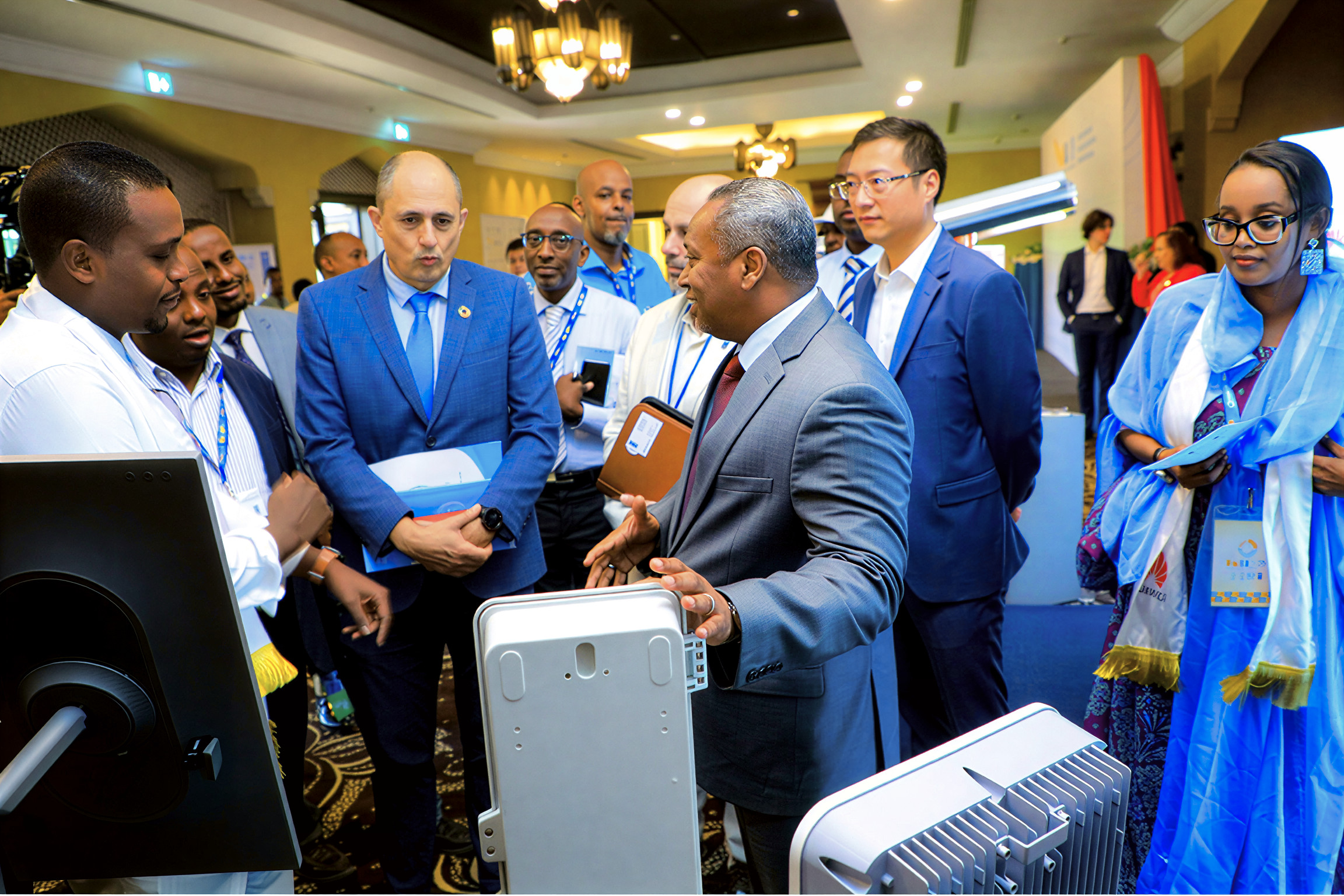 A high-level UN official and Government official in Djibouti look at a solar power installation developed by young entrepreneurs during a forum.