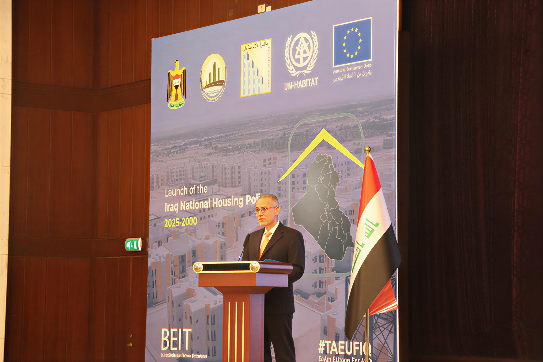 A high-level UN official gives a speech at a conference in Iraq.