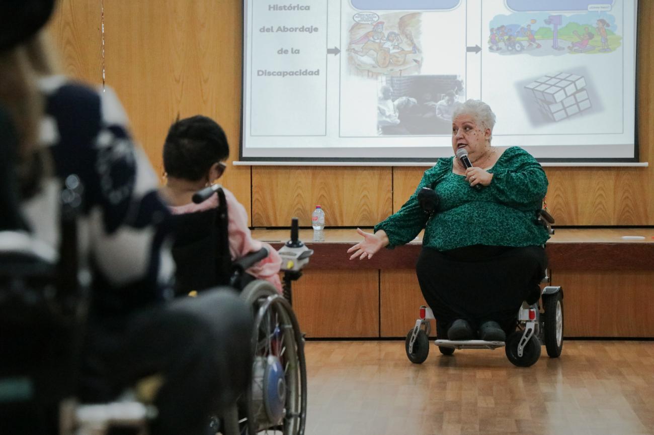 A woman with a disability participates in a workshop in the Dominican Republic.