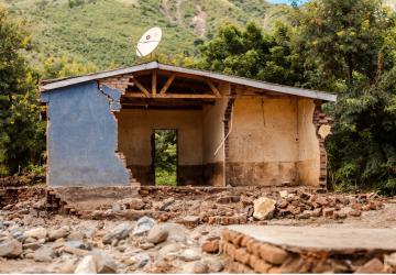 half destroyed house in the rainforest