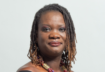 Aminatou Sar wears a colourful chain and looks directly at the camera