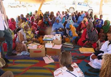 A group of people in a community dialogue