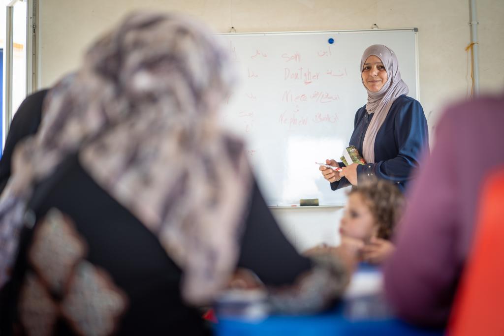 A teacher in Jordan delivers a lesson to her students.