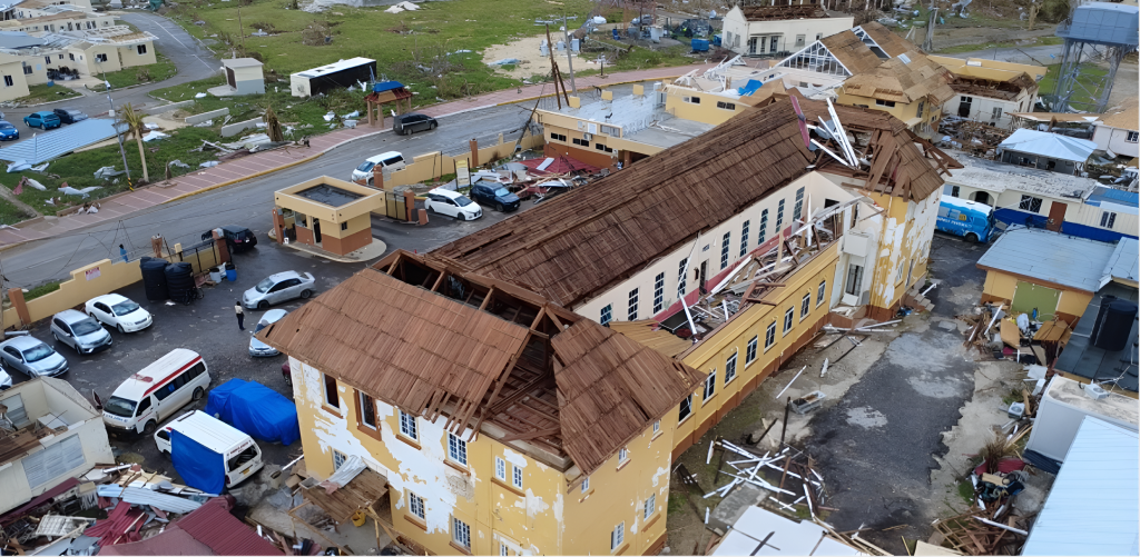 An aerial view of a damaged health facility after a hurricane in Jamaica.