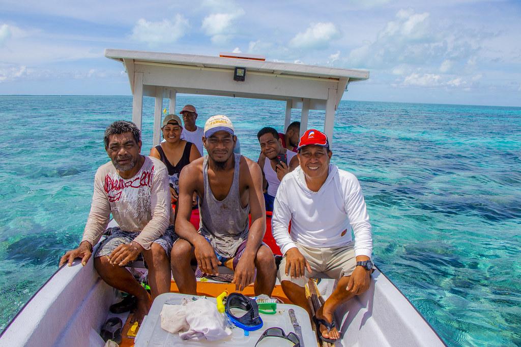 Men and women on a boat in Kiribati.
