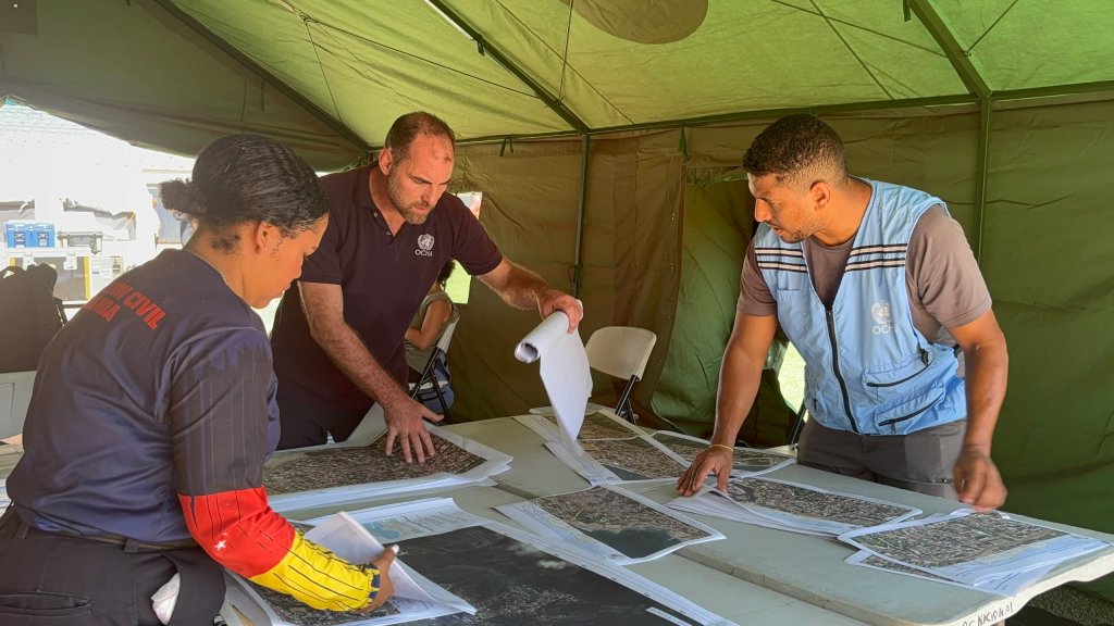 Responders looks at maps to coordinate support to Venezuela following two earthquakes. 