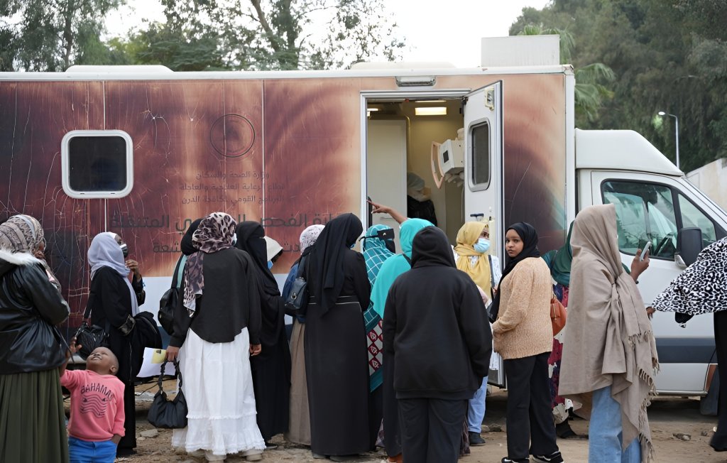 Refugee women in Egypt board a bus.