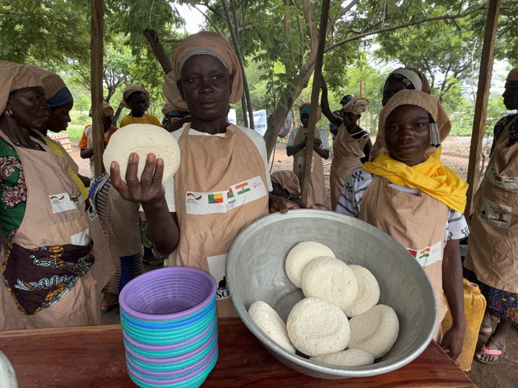 Women in Benin sell food at a market.