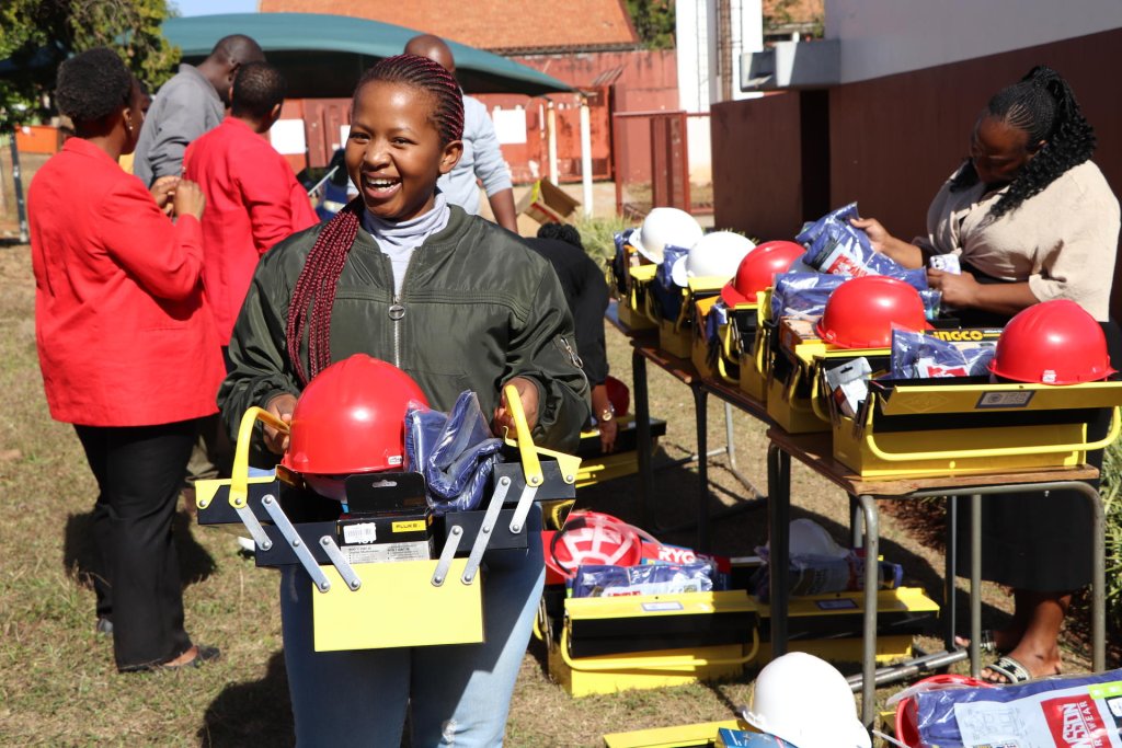 A young woman in Eswatini receives vocational tools.
