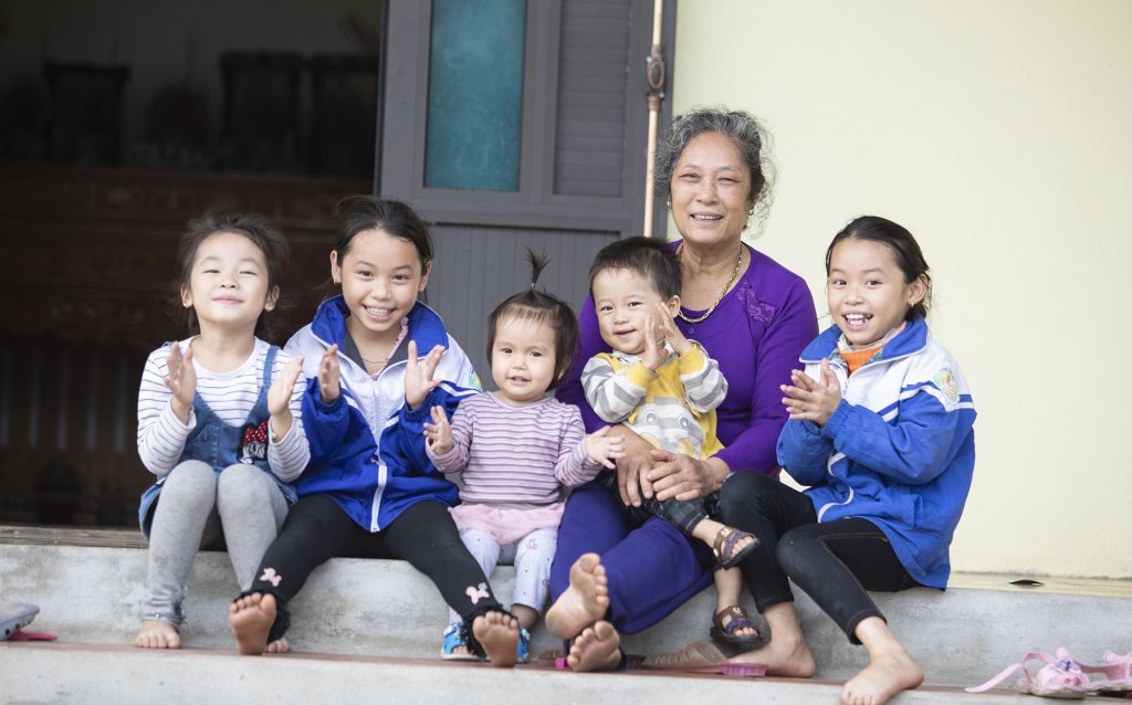 A grandmother with her five grandchildren in Viet Nam.