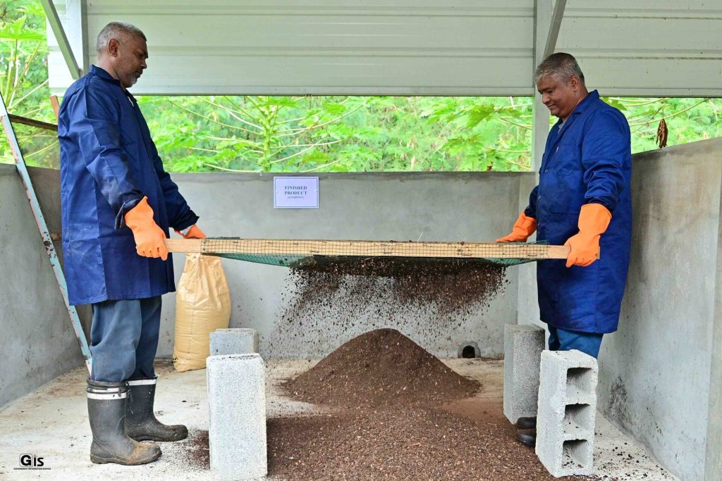 Two men in Mauritius process seaweed to be used as bio-fertiliser.