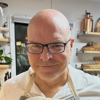 man in white shirt and glasses 