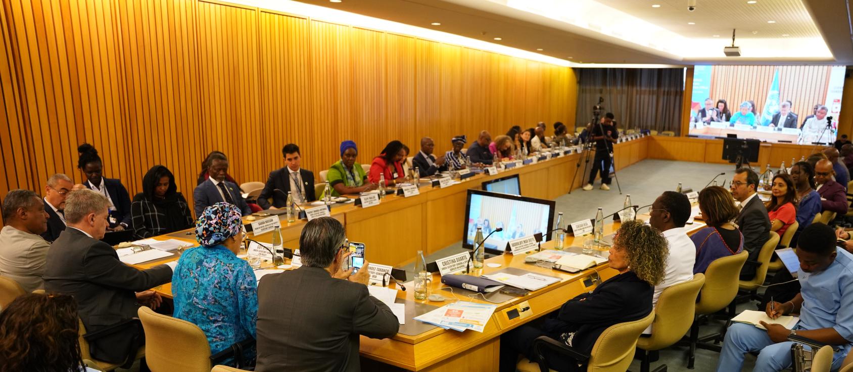 A group of RCs sit around a large table