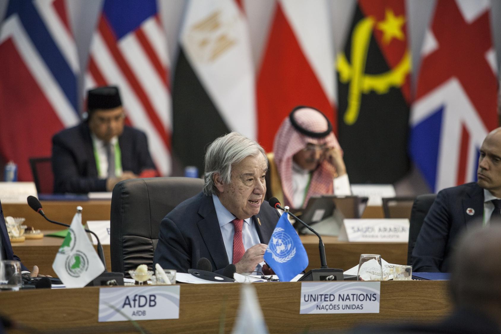 UN Secretary-General António Guterres speaks at the G20, other heads of state from the G20 seated behind him