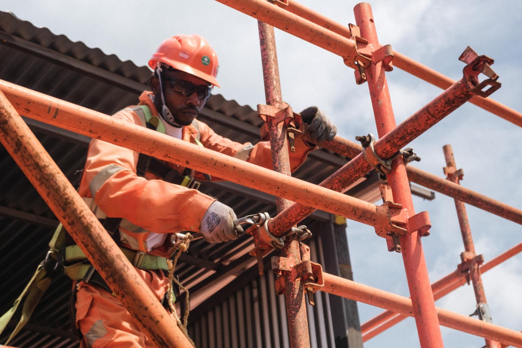 A person on scafolding building something