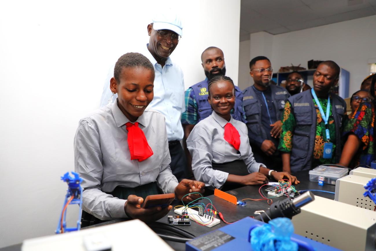 The RC watches students who are working on a electrical objects