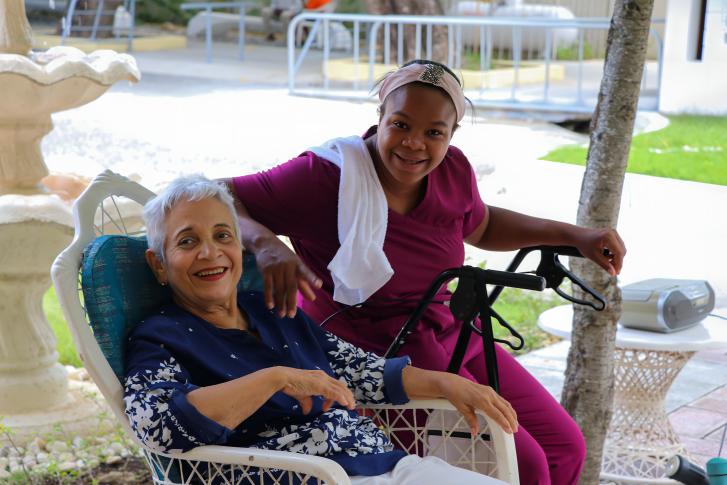 An elderly woman in the Dominican Republic with her caretaker.