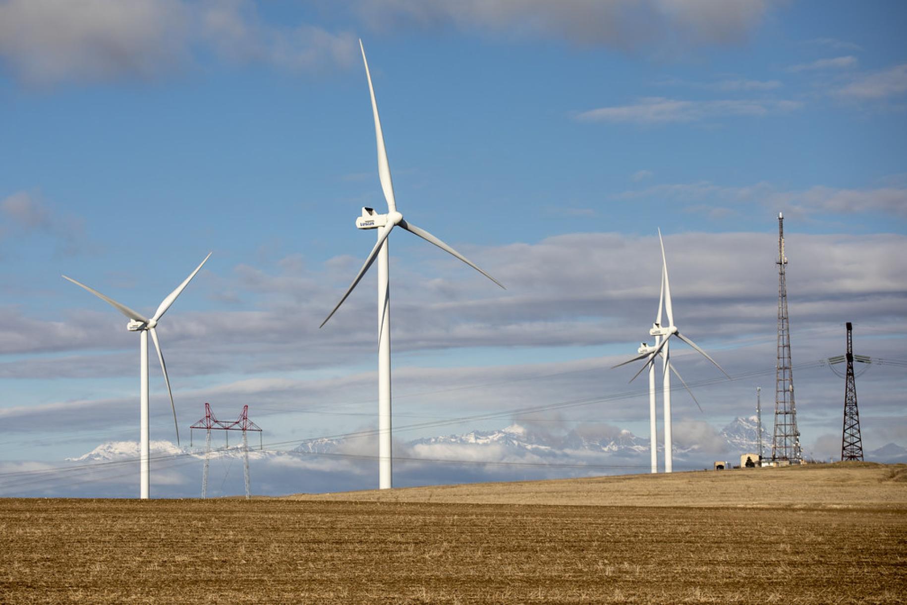 wind-farm against cloudy blue sky